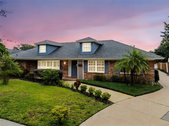 a front view of a house with garden