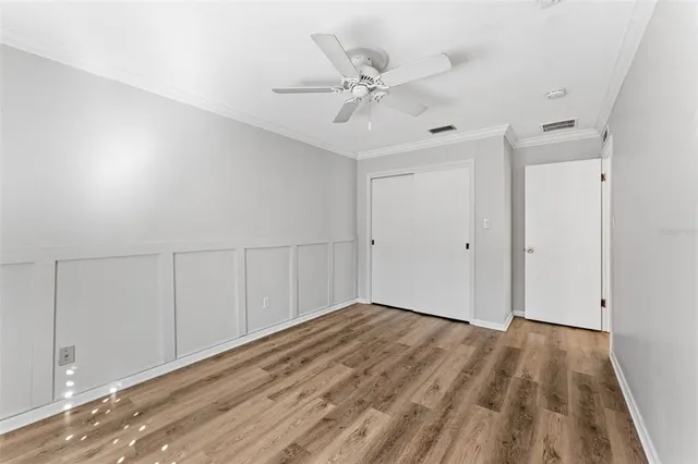a view of a room with wooden floor
