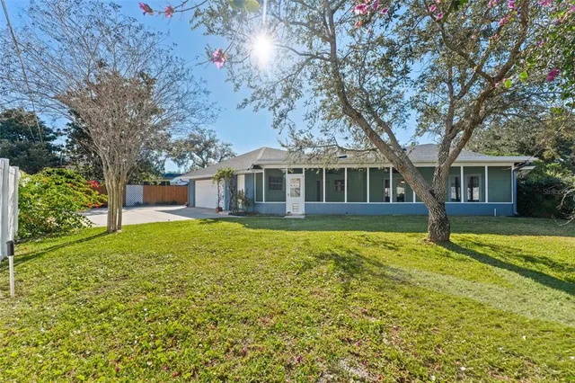 a house with swimming pool in front of it
