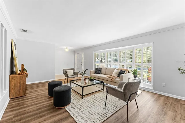 a living room with furniture and a window