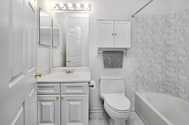 a bathroom with a sink a toilet and a bathtub