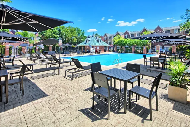 a view of patio with table and chairs and potted plants