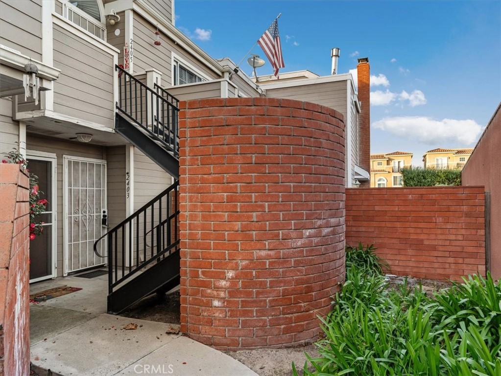 a brick building with a small yard