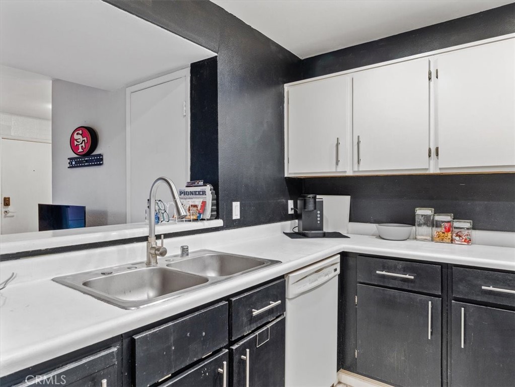 2403 Country Santa Maria, CA 93455 - Photo 13 of 29 a kitchen with a sink a stove and cabinets