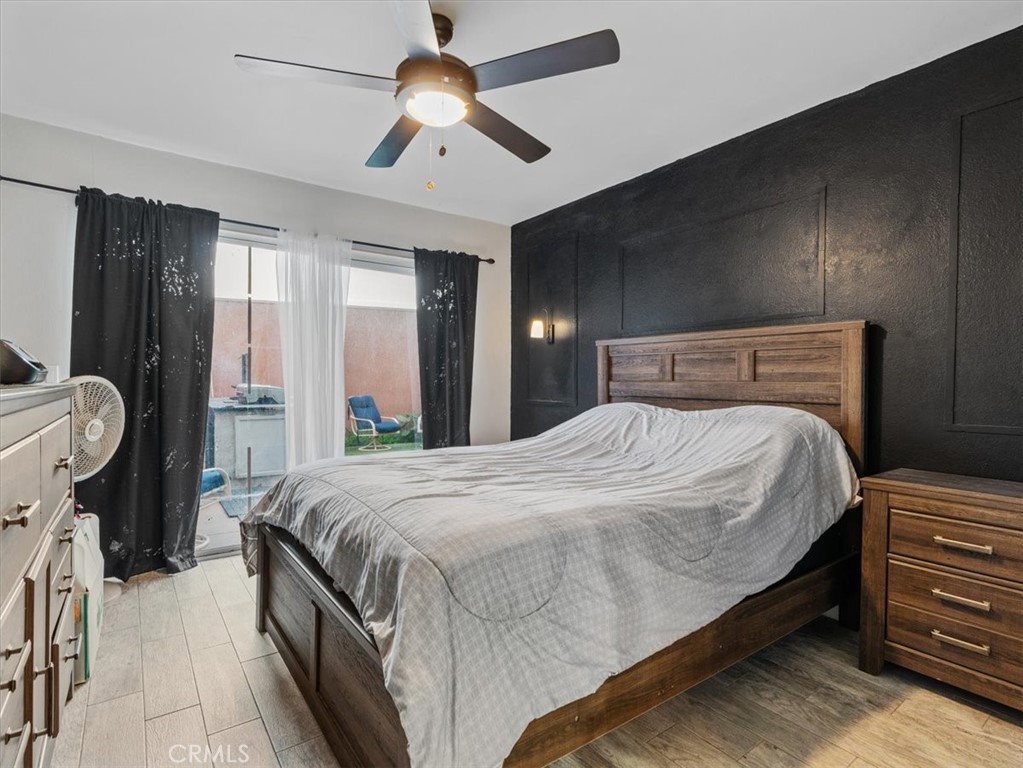 2403 Country Santa Maria, CA 93455 - Photo 20 of 29 a bedroom with a bed and a chandelier