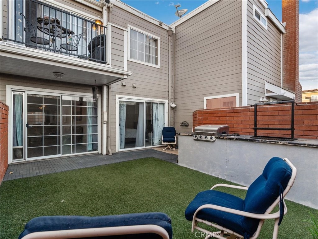 2403 Country Santa Maria, CA 93455 - Photo 3 of 29 a backyard of a house with table and chairs