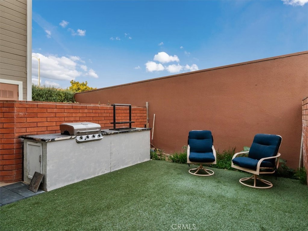 2403 Country Santa Maria, CA 93455 - Photo 6 of 29 a view of a chairs and table in backyard