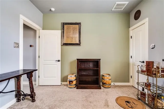 a view of a livingroom with furniture and a window
