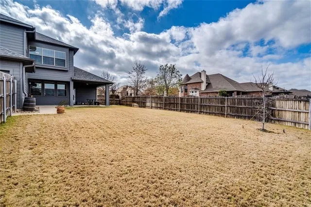a view of a house with a snow in the yard