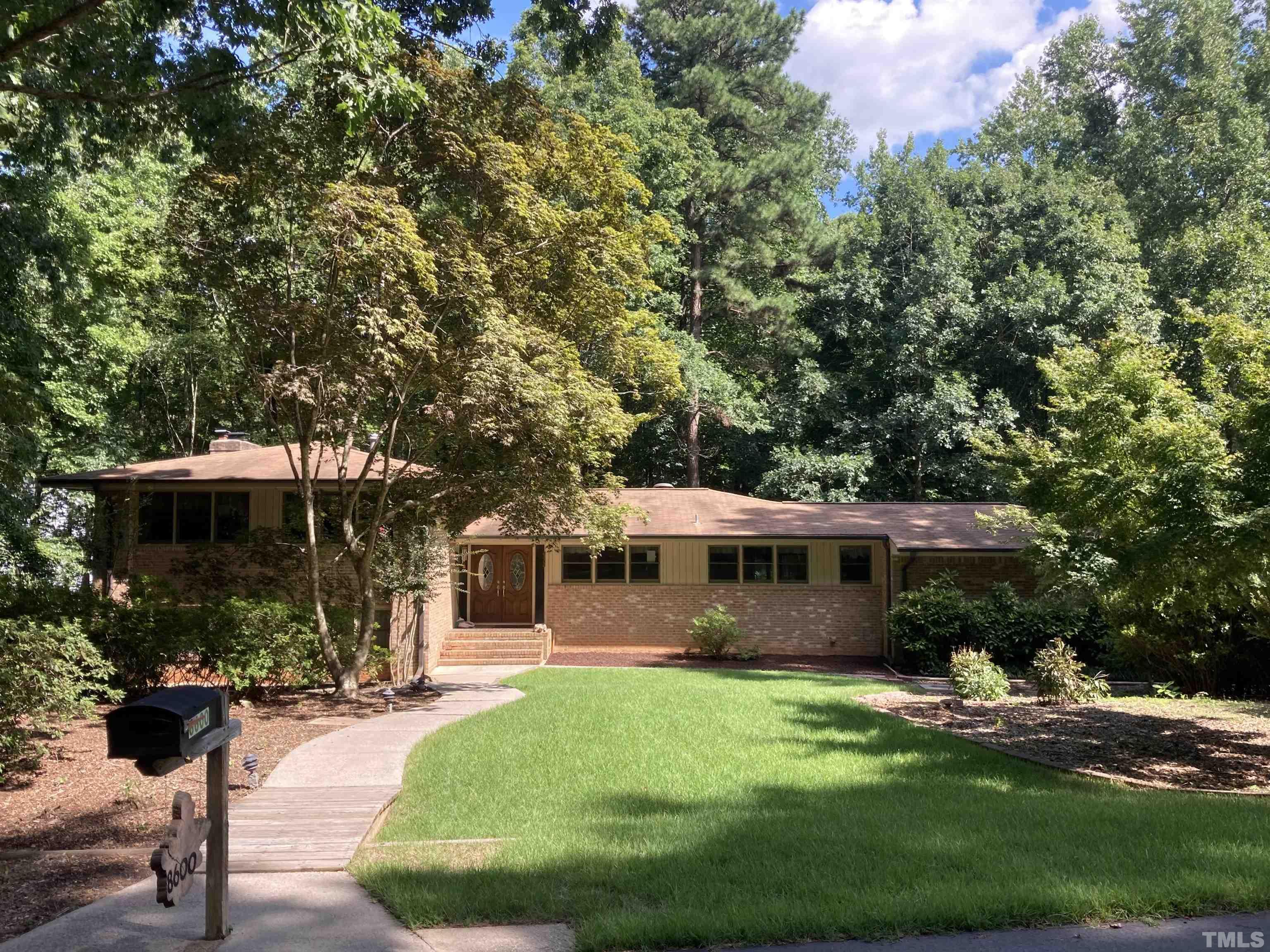 8600 Lawn Court Raleigh, NC 27613 - Photo 1 of 31 a view of a house with a yard
