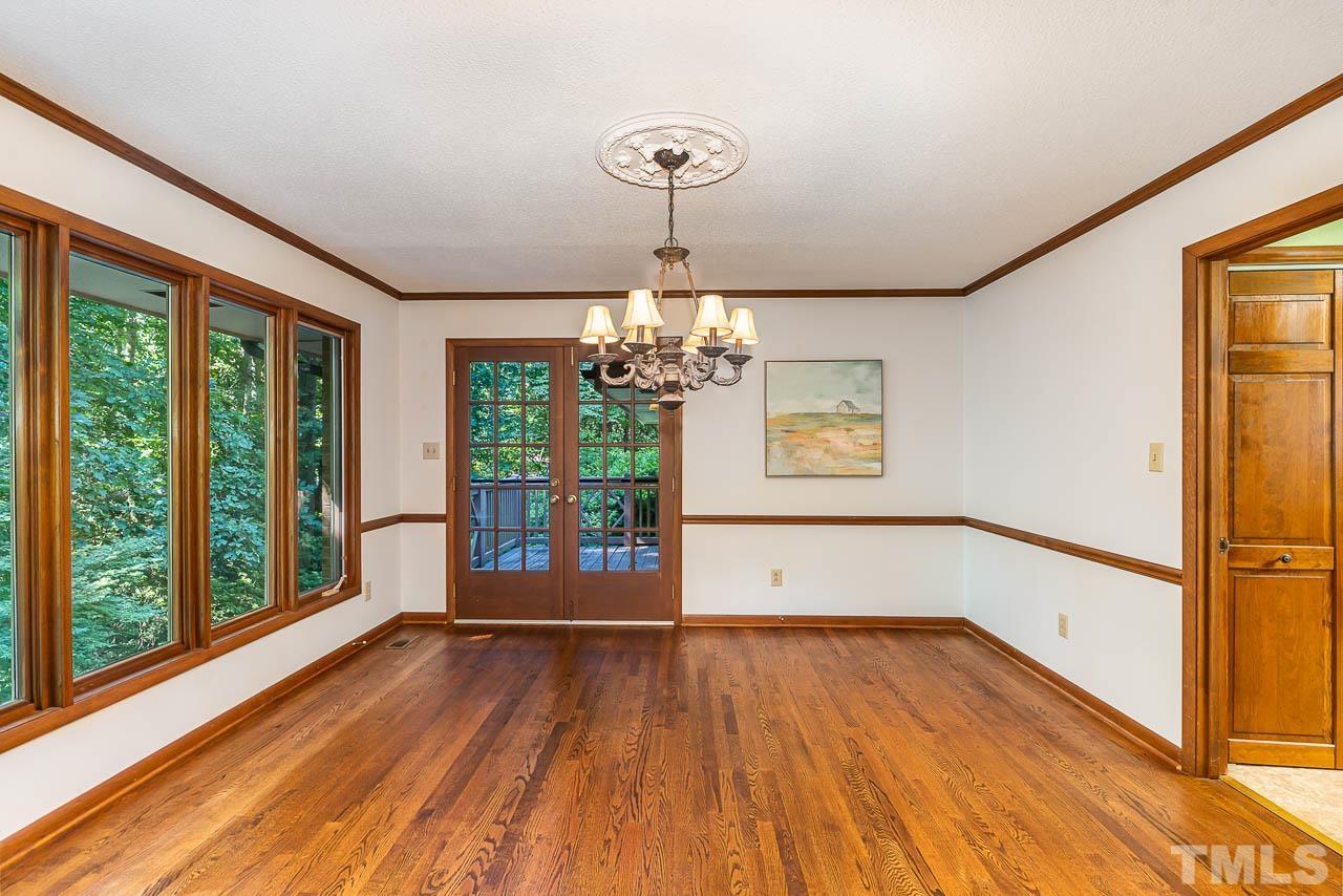 8600 Lawn Court Raleigh, NC 27613 - Photo 12 of 31 a view of empty room with wooden floor and fan