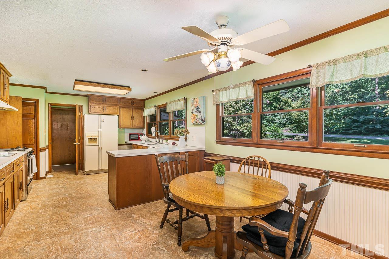 8600 Lawn Court Raleigh, NC 27613 - Photo 13 of 31 a view of a dining room with furniture window and outside view
