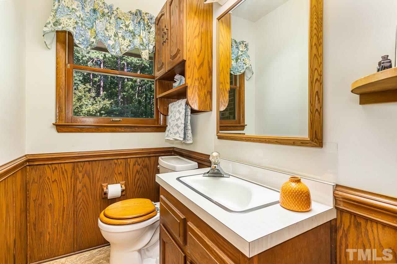 8600 Lawn Court Raleigh, NC 27613 - Photo 17 of 31 a bathroom with a sink and a mirror
