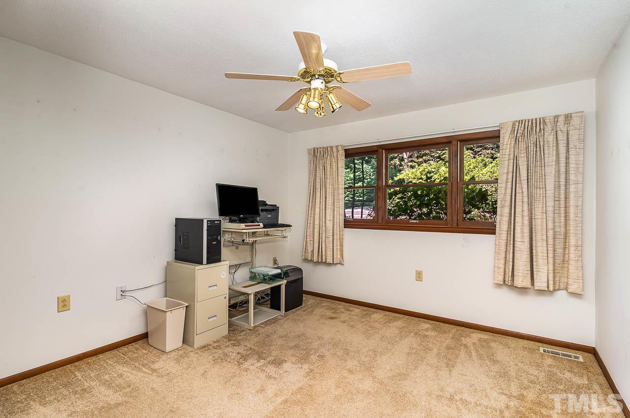 8600 Lawn Court Raleigh, NC 27613 - Photo 27 of 31 a view of a workspace with furniture and a window