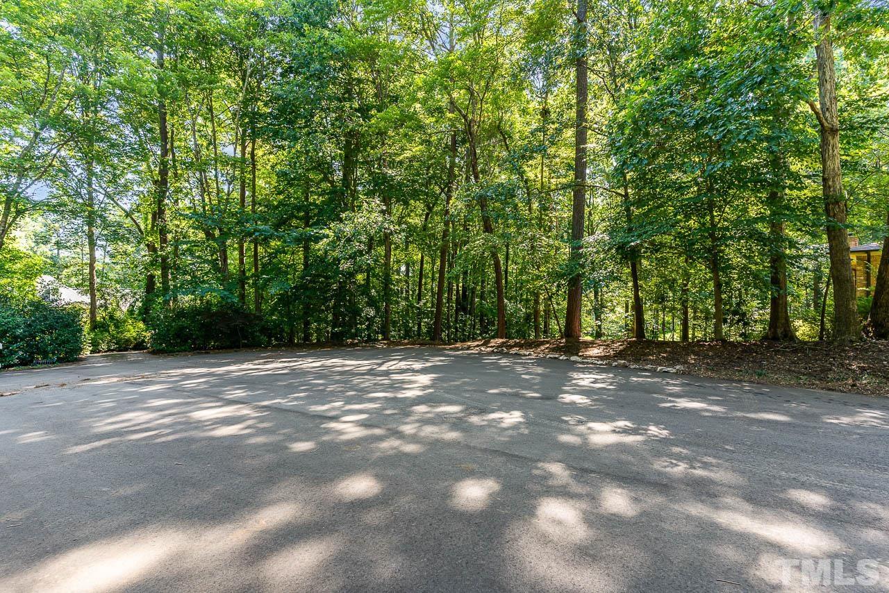 8600 Lawn Court Raleigh, NC 27613 - Photo 31 of 31 a view of a field with trees in the background