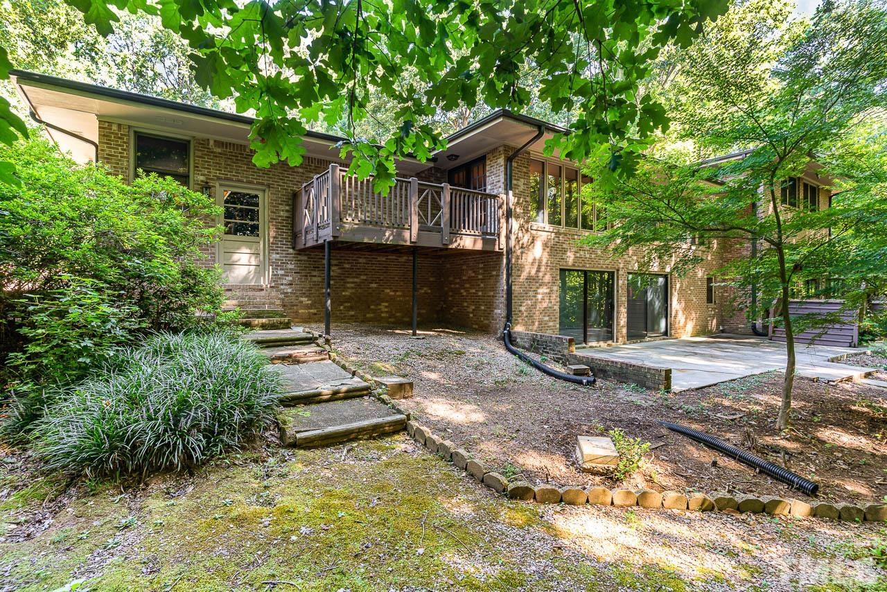 8600 Lawn Court Raleigh, NC 27613 - Photo 6 of 31 a view of a house with a yard and large tree