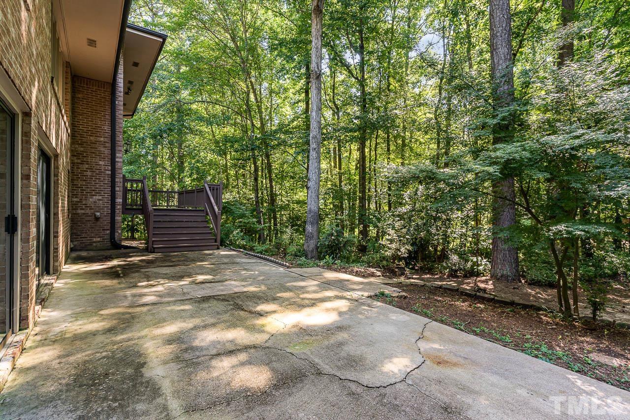 8600 Lawn Court Raleigh, NC 27613 - Photo 8 of 31 a view of a yard with plants and trees