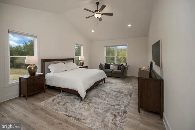 a bedroom with a bed furniture and a window