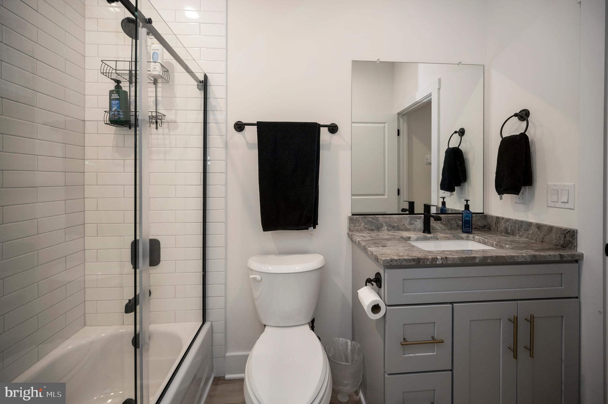 0 Piney Mountain Road Warrenton, VA 20186 - Photo 27 of 33 a bathroom with a granite countertop sink toilet and shower