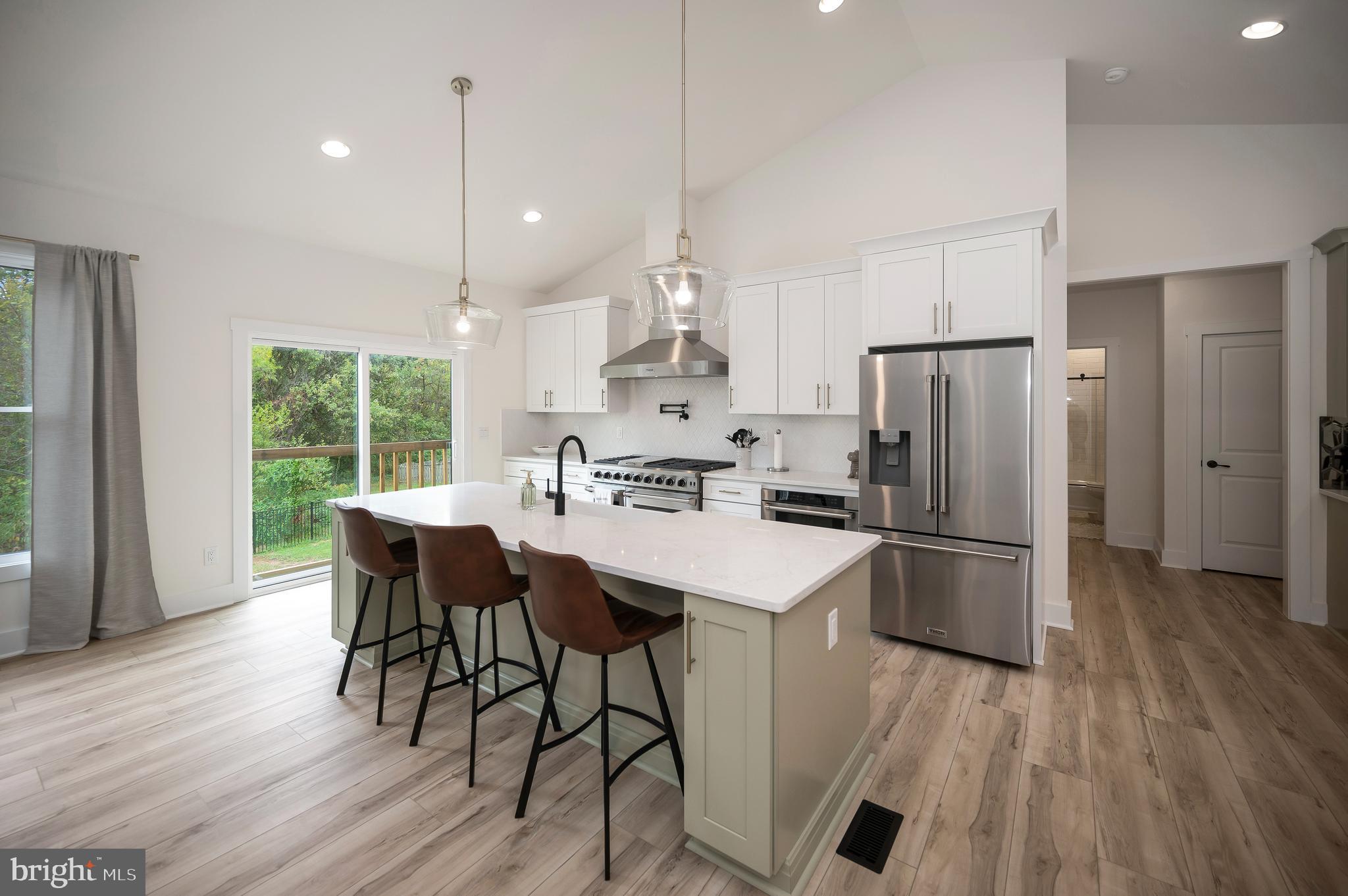 0 Piney Mountain Road Warrenton, VA 20186 - Photo 8 of 33 a kitchen with stainless steel appliances granite countertop a refrigerator a sink dishwasher a stove and a refrigerator with wooden floor