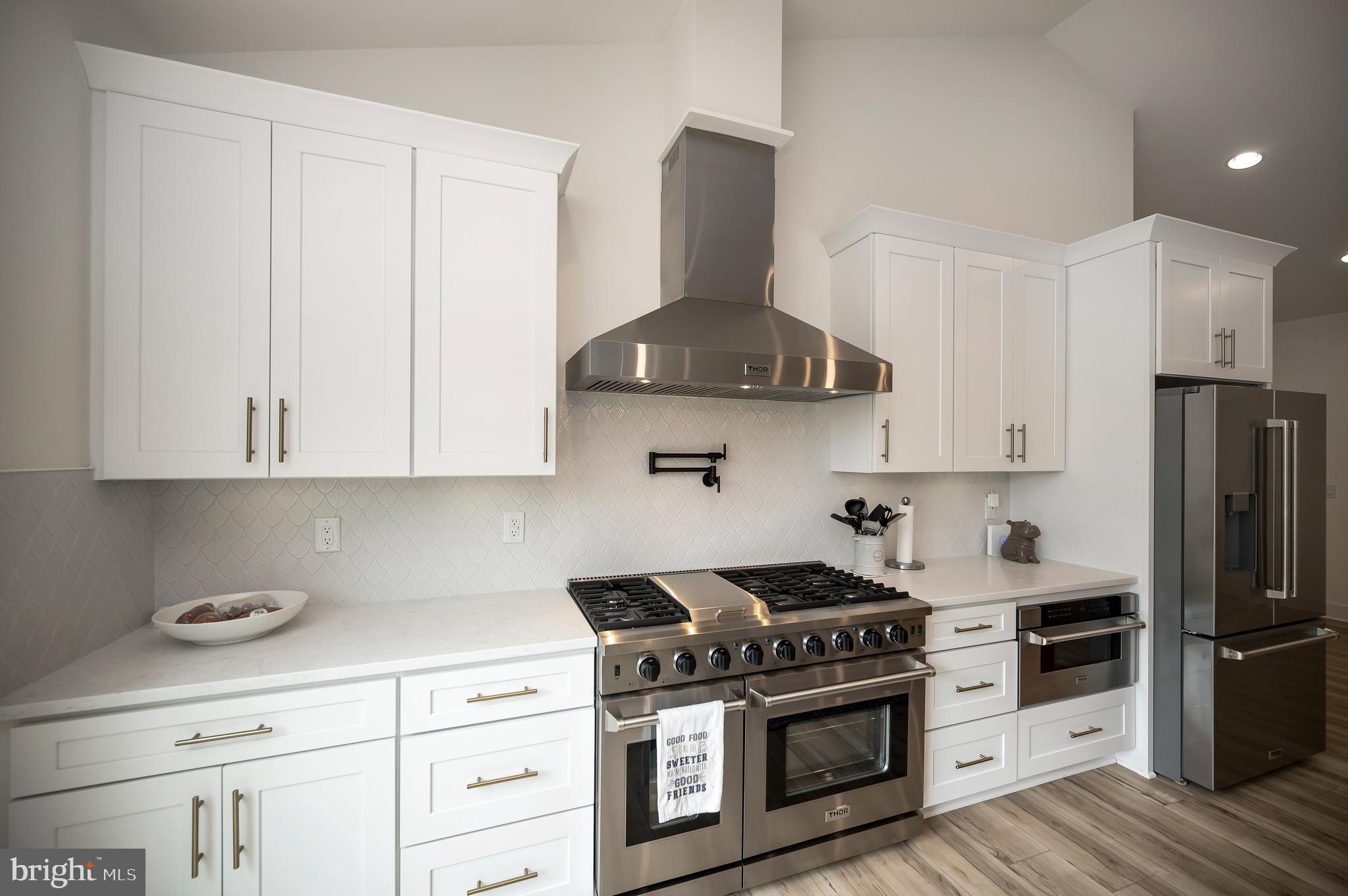0 Piney Mountain Road Warrenton, VA 20186 - Photo 9 of 33 a kitchen with stainless steel appliances granite countertop a stove a refrigerator and a white cabinets
