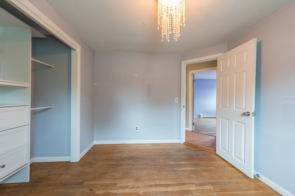 3 Sears Avenue Webster, MA 01570 - Photo 11 of 27 an empty room with wooden floor & windows