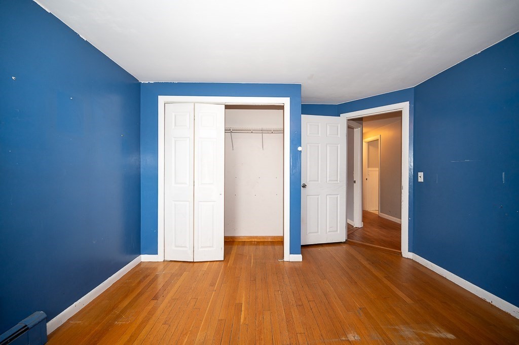3 Sears Avenue Webster, MA 01570 - Photo 16 of 27 an empty room with wooden floor and closet