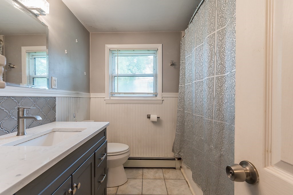3 Sears Avenue Webster, MA 01570 - Photo 6 of 27 a bathroom with a sink a toilet and shower