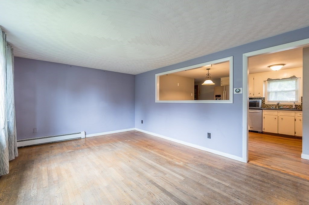 3 Sears Avenue Webster, MA 01570 - Photo 9 of 27 a view of a kitchen with wooden floor and a sink