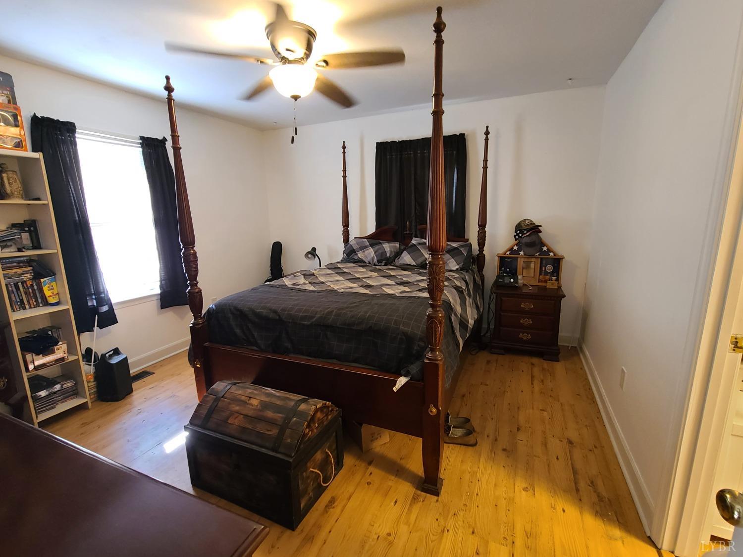 1641 Roark Mill Road Hurt, VA 24563 - Photo 14 of 52 a bed room with furniture and a flat screen tv