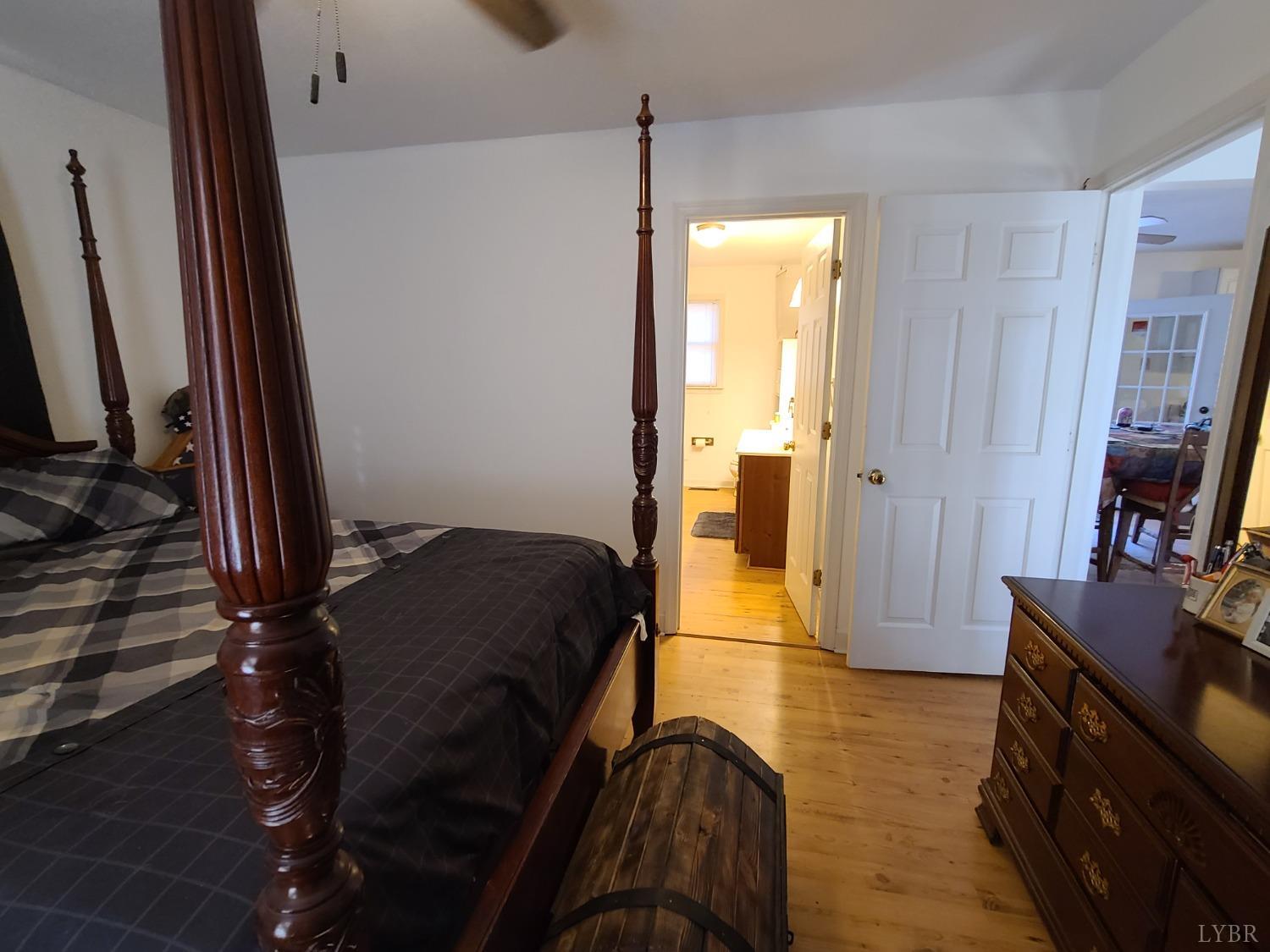 1641 Roark Mill Road Hurt, VA 24563 - Photo 15 of 52 a bedroom with a bed and a flat tv screen on the dresser
