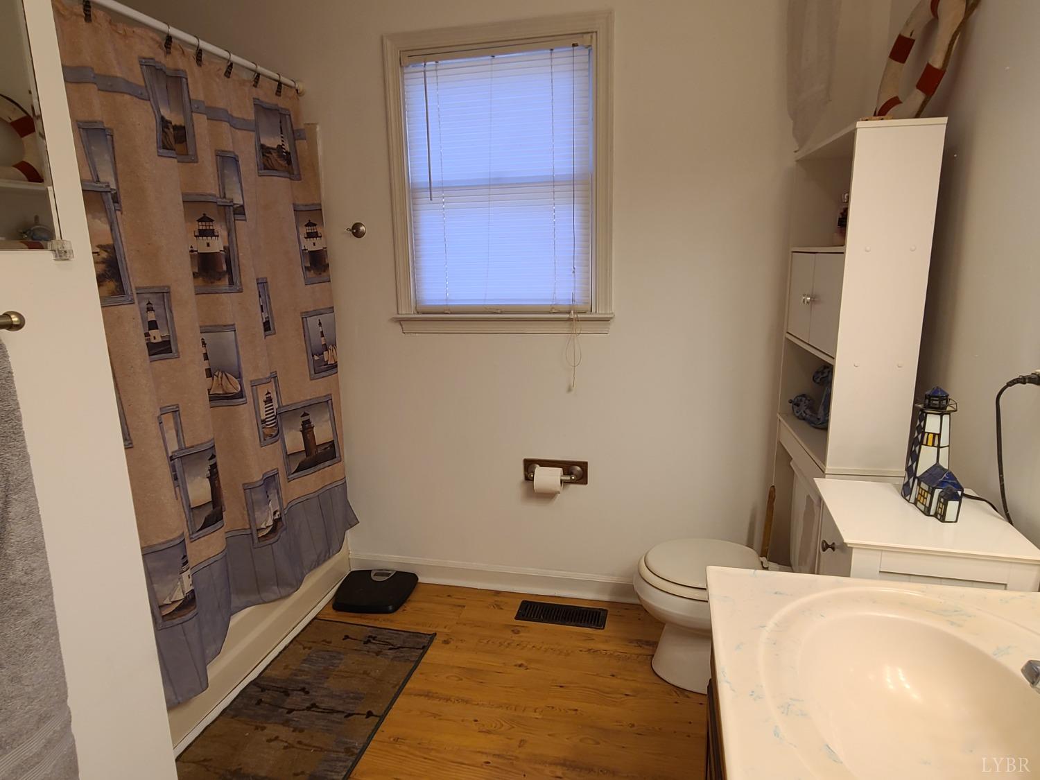 1641 Roark Mill Road Hurt, VA 24563 - Photo 17 of 52 a bathroom with a sink and a mirror
