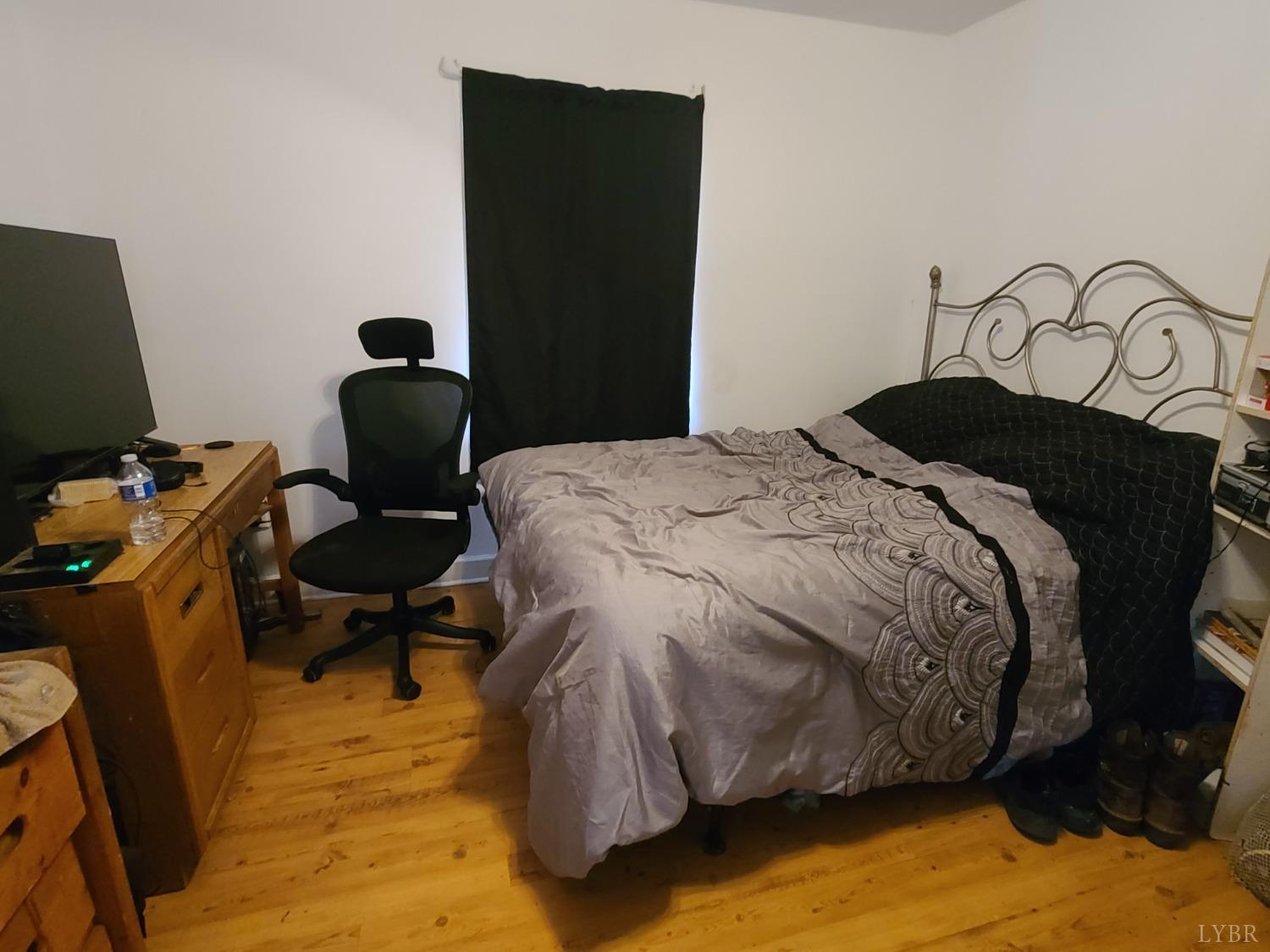1641 Roark Mill Road Hurt, VA 24563 - Photo 23 of 52 a bedroom with a bed chair and a desk