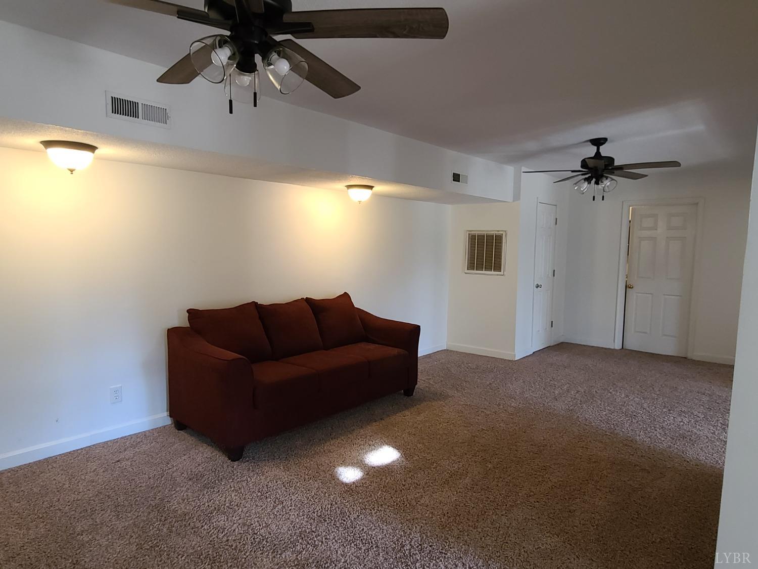 1641 Roark Mill Road Hurt, VA 24563 - Photo 30 of 52 a living room with furniture and a ceiling fan