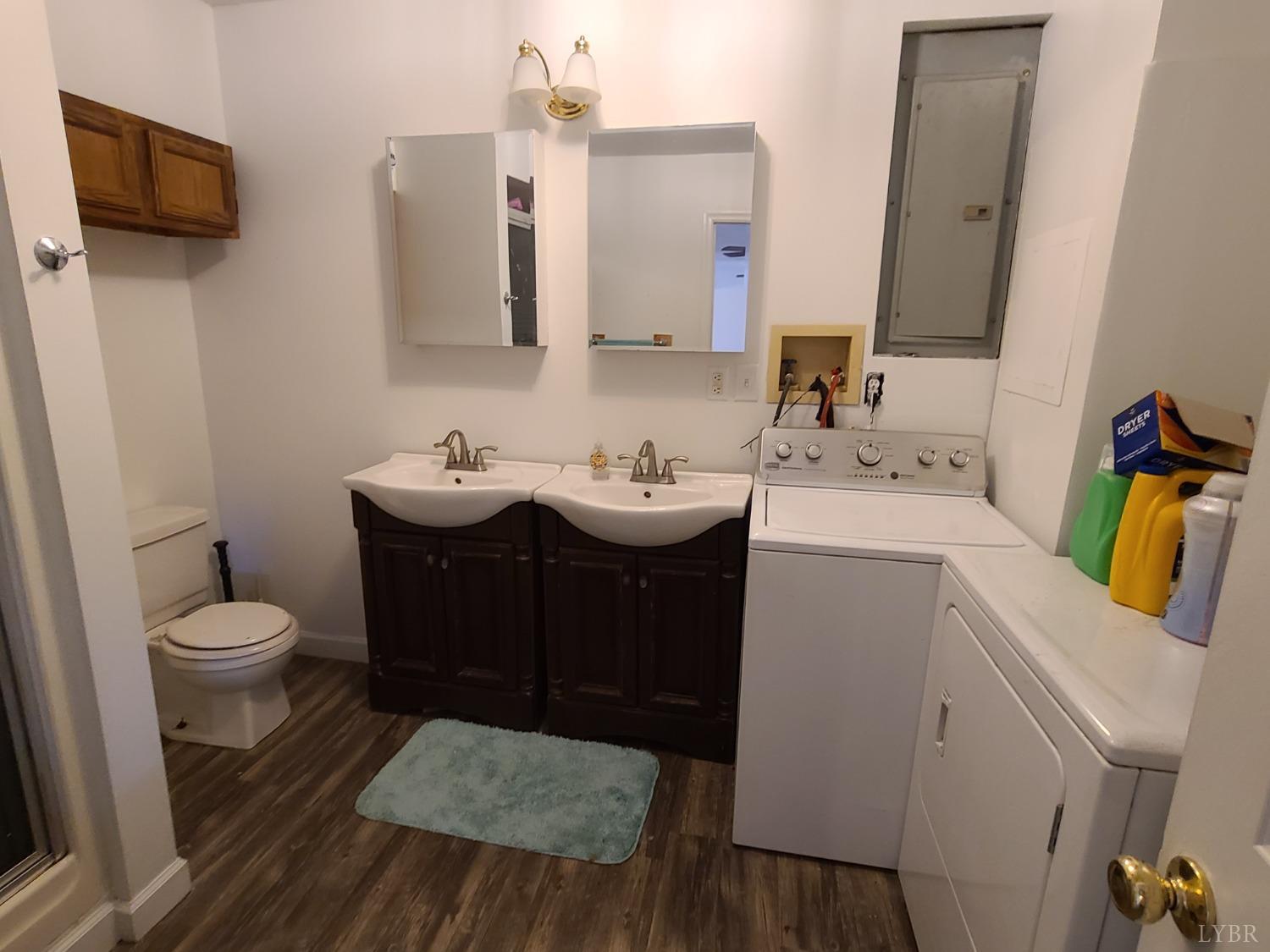 1641 Roark Mill Road Hurt, VA 24563 - Photo 38 of 52 a bathroom with a sink toilet and mirror