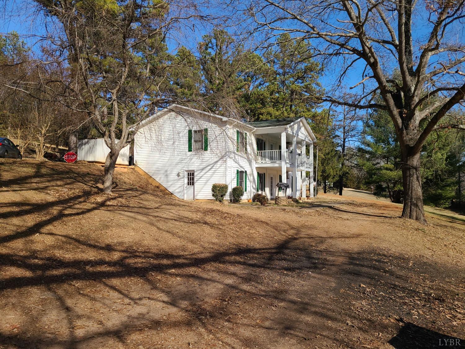 1641 Roark Mill Road Hurt, VA 24563 - Photo 47 of 52 a front view of a house with a yard covered in snow