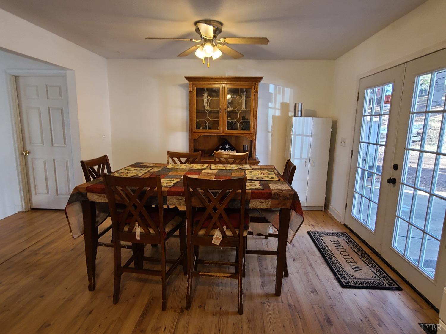 1641 Roark Mill Road Hurt, VA 24563 - Photo 8 of 52 a view of a dining room with furniture window and wooden floor