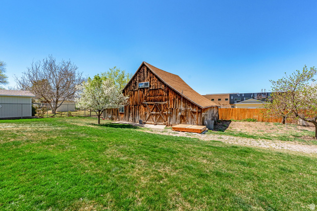 75 North 100th Street West Fillmore, UT 84631 - Photo 54 of 62 Rear view of property with an outdoor structure and a barn