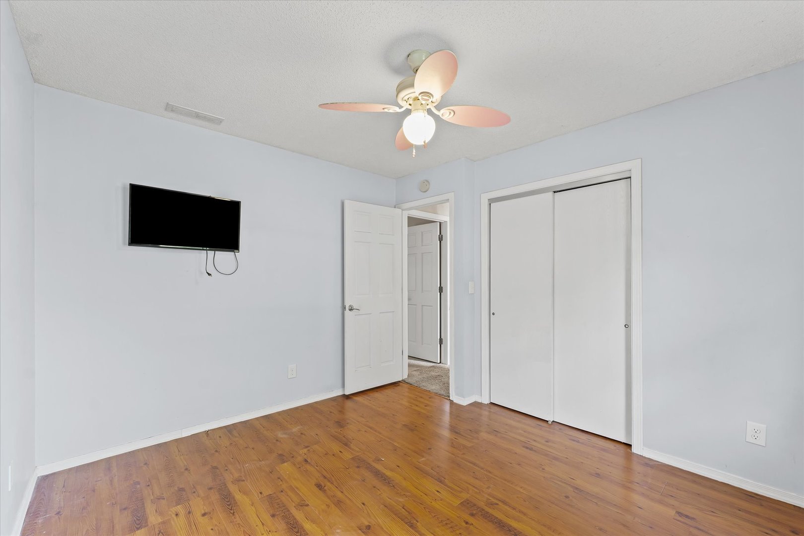 502 Ridge Road Philo, IL 61864 - Photo 17 of 28 a view of a livingroom with a ceiling fan wooden floor and a chandelier fan