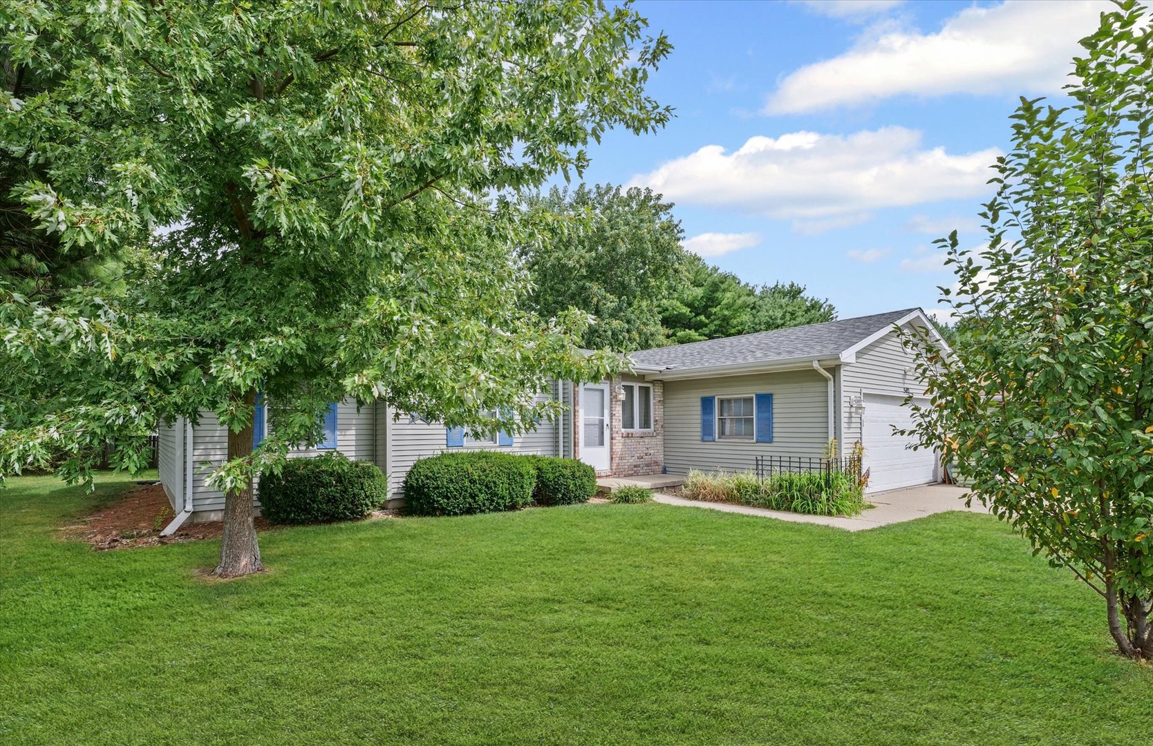 502 Ridge Road Philo, IL 61864 - Photo 2 of 28 a view of backyard of a house with plants and large tree
