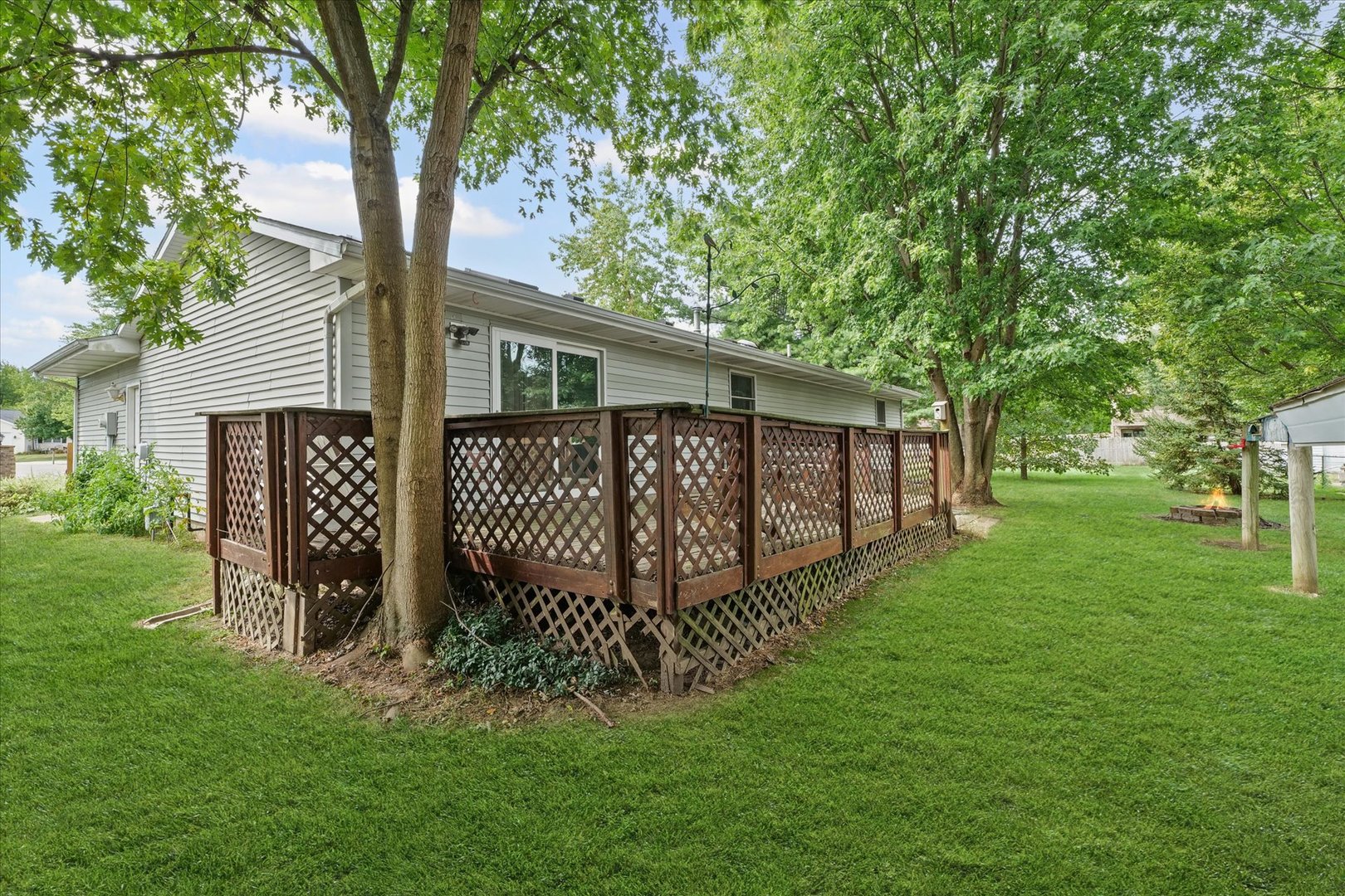 502 Ridge Road Philo, IL 61864 - Photo 22 of 28 a view of a house with a yard and tree