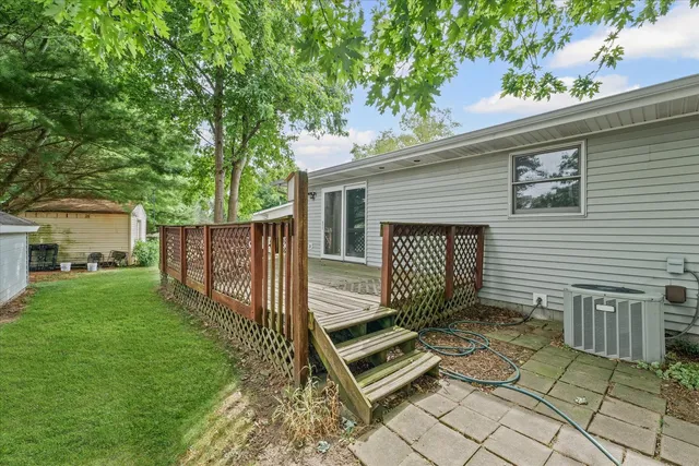 a view of balcony with wooden floor and outdoor seating