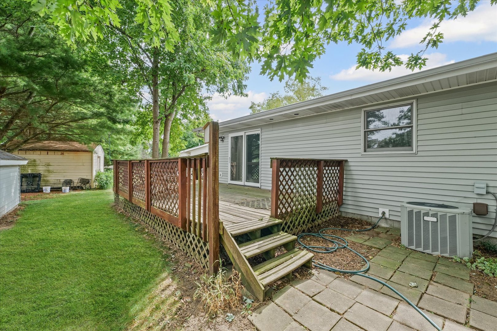 502 Ridge Road Philo, IL 61864 - Photo 25 of 28 a view of a house with backyard and wooden fence