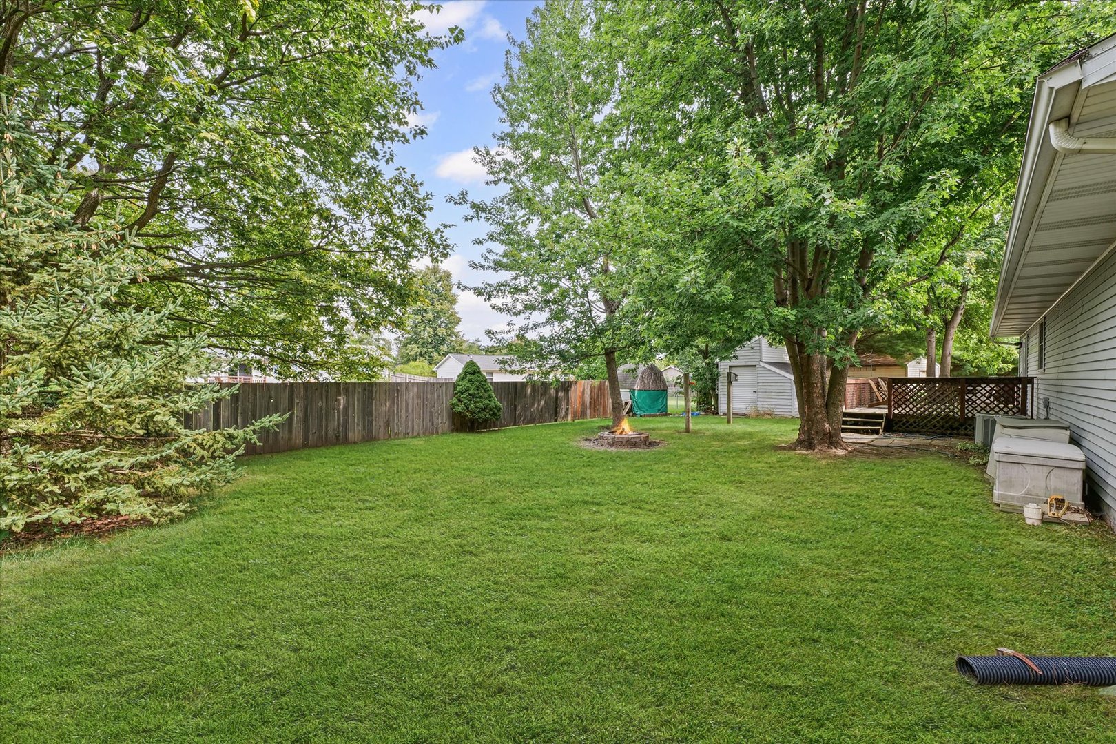 502 Ridge Road Philo, IL 61864 - Photo 27 of 28 a view of a backyard with large trees