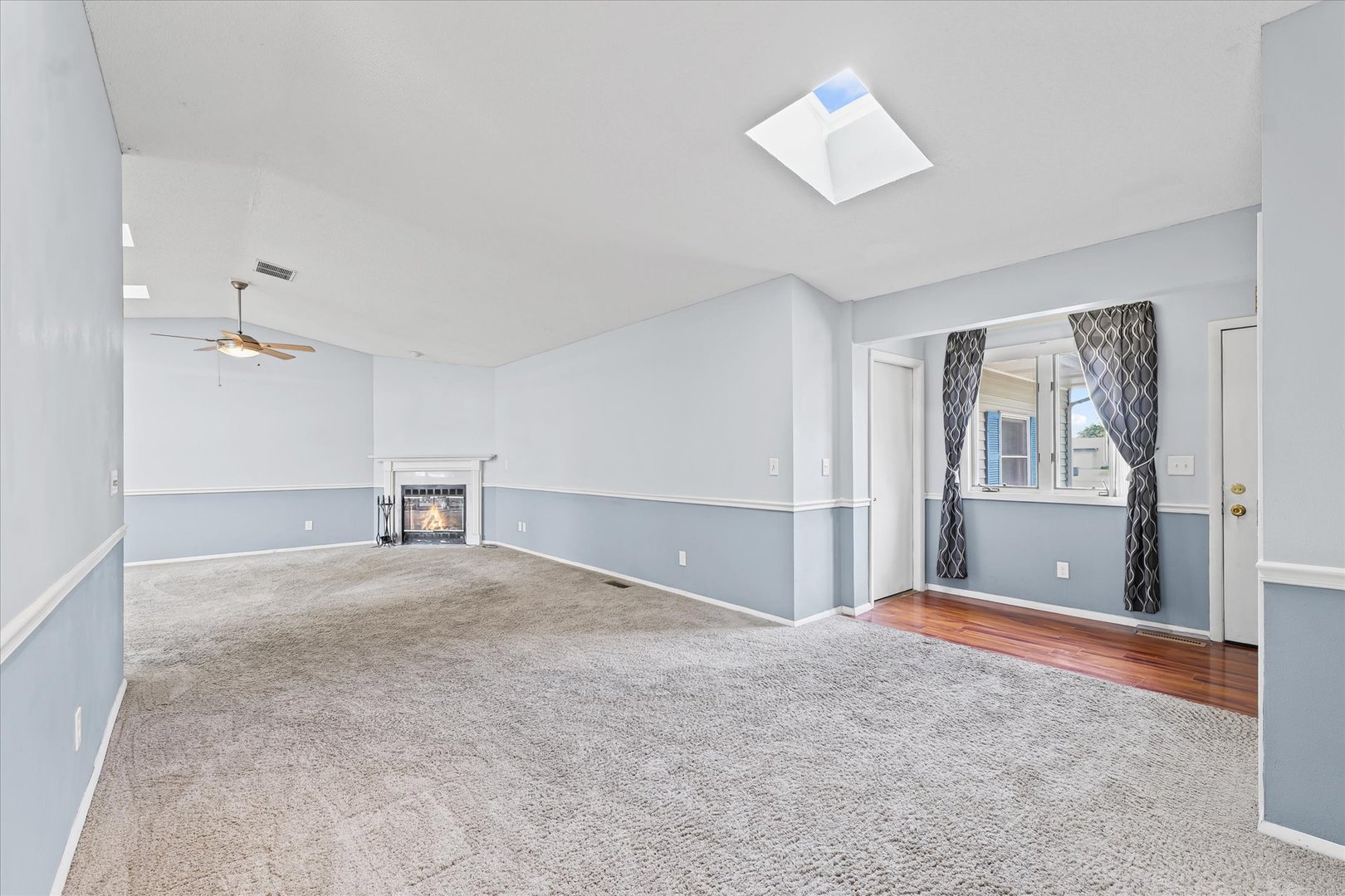 502 Ridge Road Philo, IL 61864 - Photo 4 of 28 a view of an empty room with a window