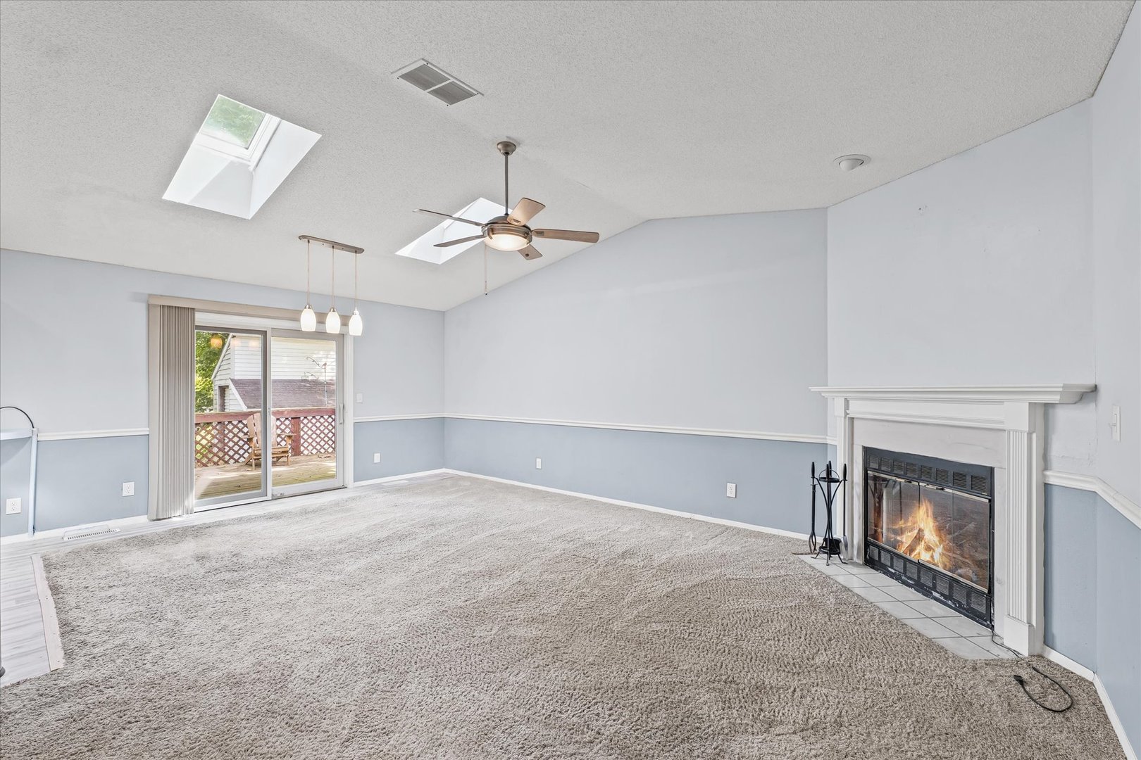 502 Ridge Road Philo, IL 61864 - Photo 7 of 28 an empty room with windows and fireplace