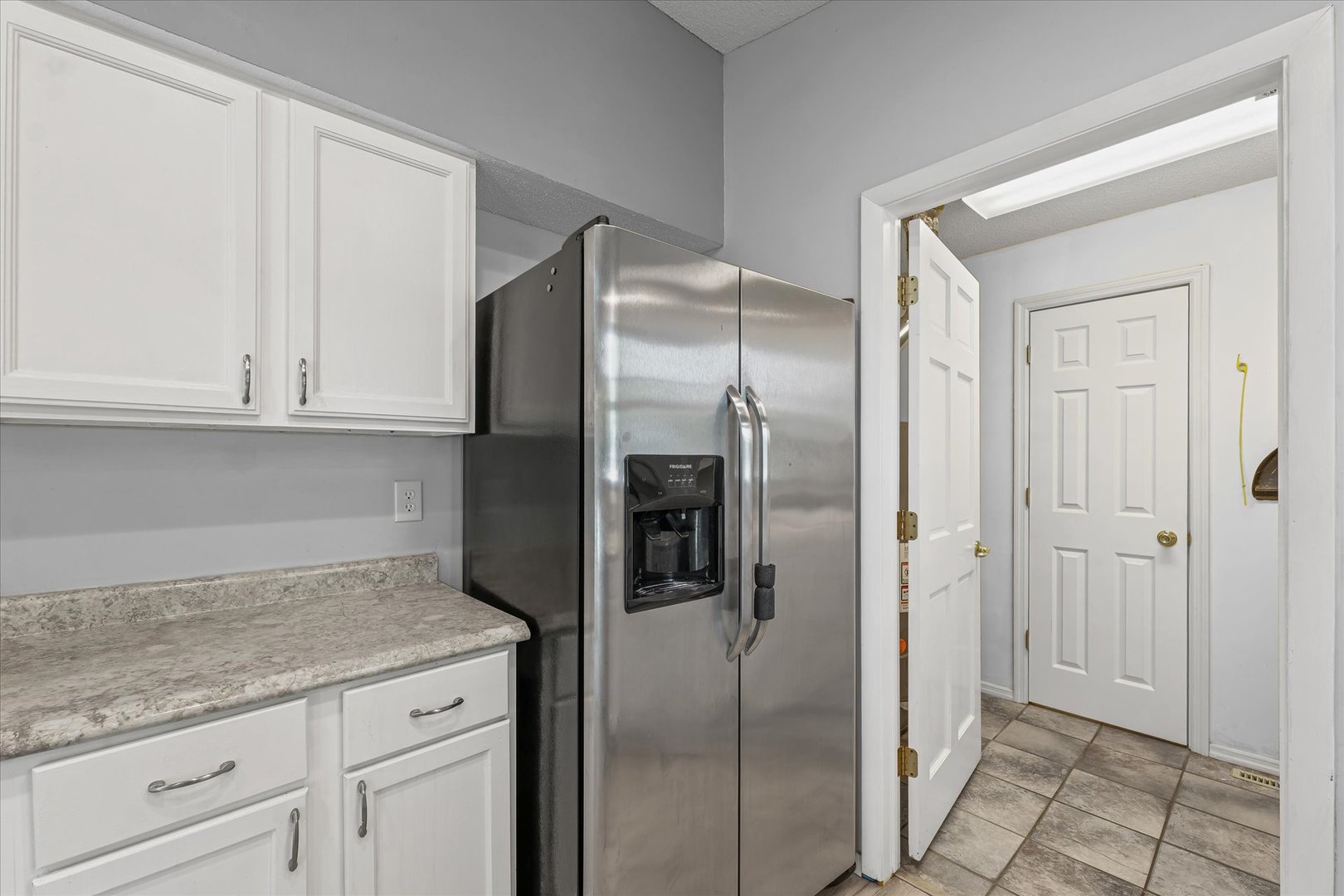 502 Ridge Road Philo, IL 61864 - Photo 10 of 28 a kitchen with stainless steel appliances granite countertop a refrigerator and white cabinets