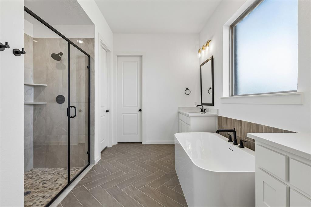 15852 Amber Street Frisco, TX 75033 - Photo 10 of 19 You'll enjoy a spacious walk in shower plus a luxurious free standing tub in this dream owner's bath!