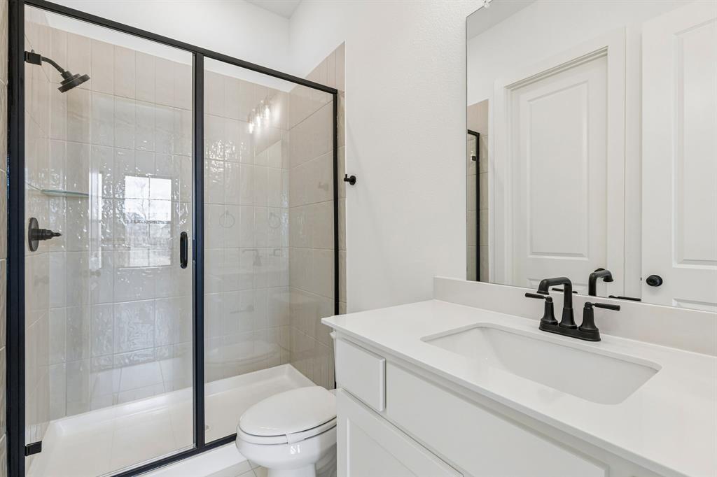 15852 Amber Street Frisco, TX 75033 - Photo 16 of 19 Friends and family will feel right at home in any of the beautifully finished guest baths.