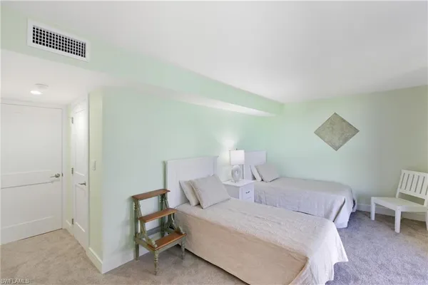 a bedroom with a bed and with window